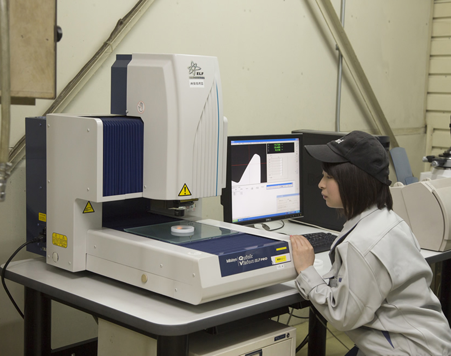 Technician using laboratory analysis equipment